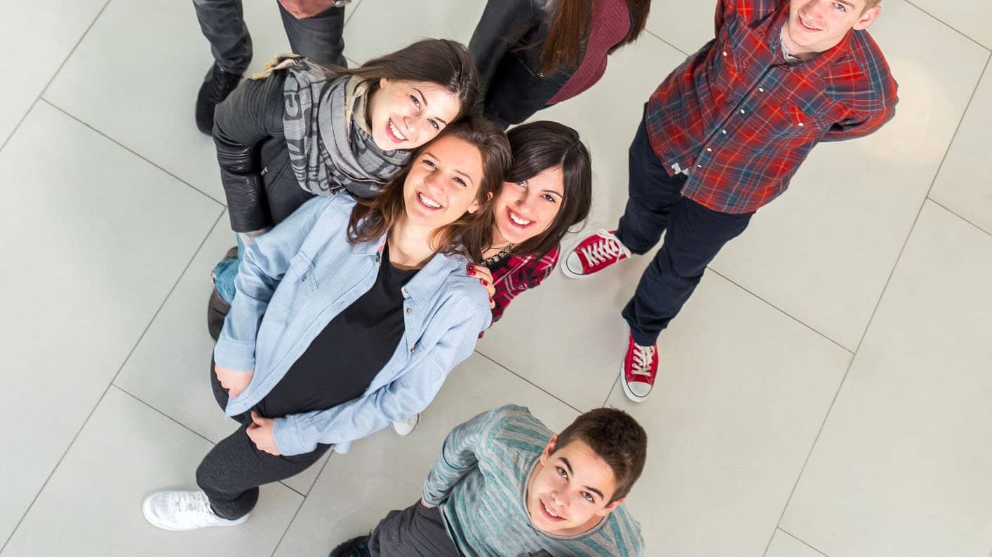 Medium group of students in the school building.